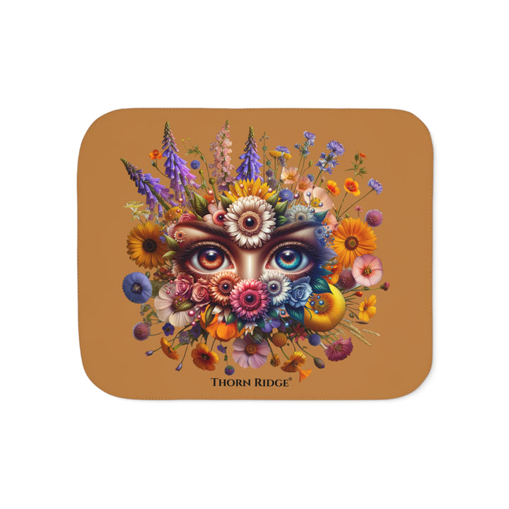 Colorful floral design with eyes on a brown background, featuring the brand 'Thorn Ridge'.