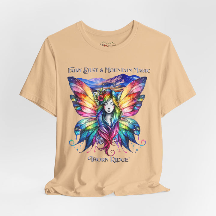 Fairy Dust and Mountain Magic graphic tee with a winged fairy in the front and mountains in the background labeled Thorn Ridge®