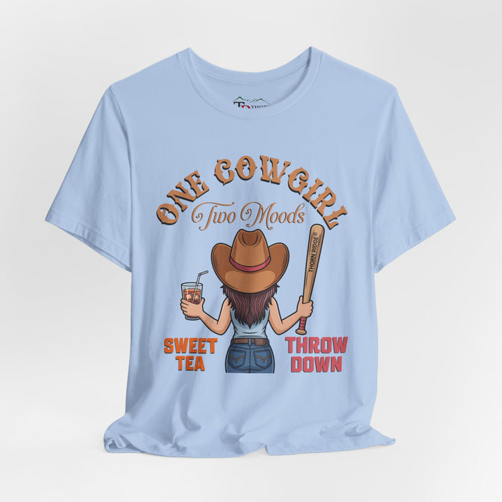 t-shirt with a graphic of a cowgirl holding a drink and a bat, with text 'One Cowgirl Two Moods Sweet Tea Throw Down' labeled Thorn Ridge®