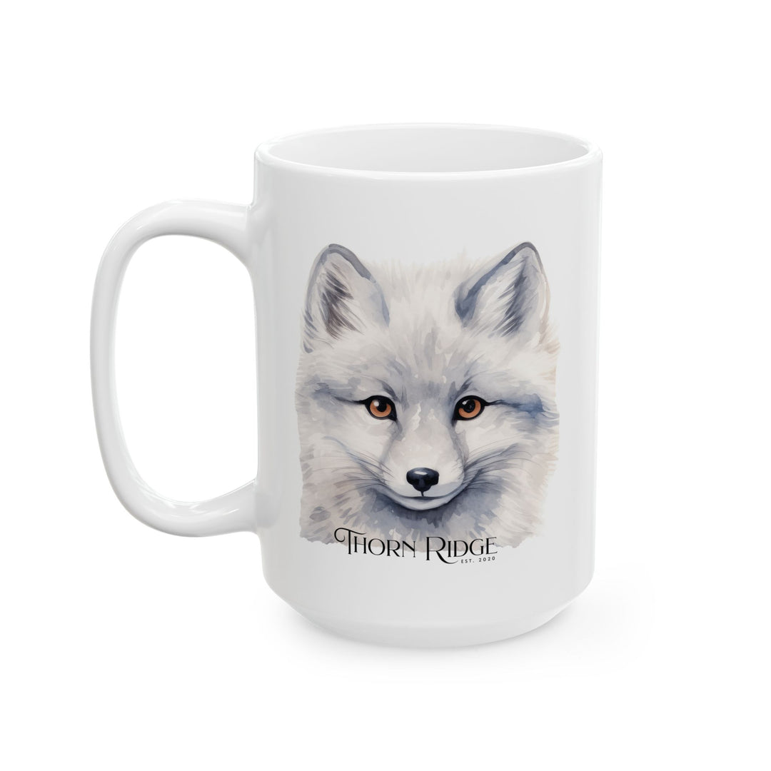 White mug with a graphic of a artic fox head and 'Thorn Ridge' text on a white background