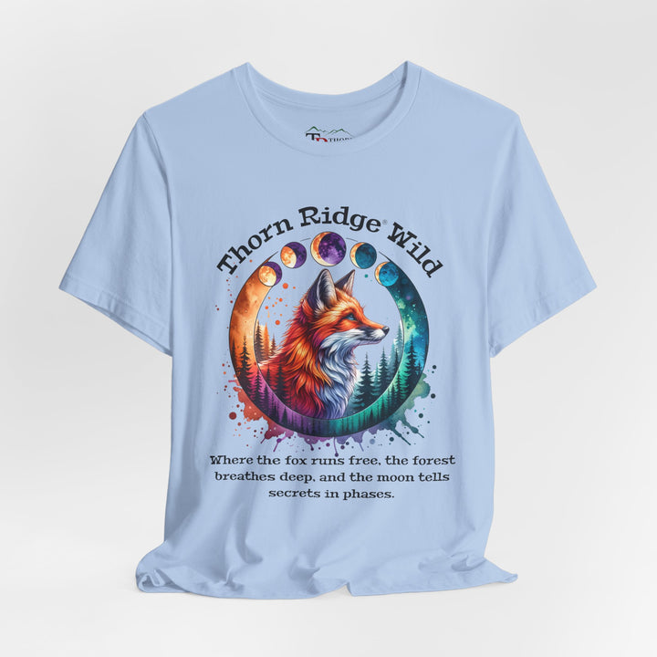 Thorn Ridge Wild Graphic Tee featuring a fox, forest, and moon phases. 