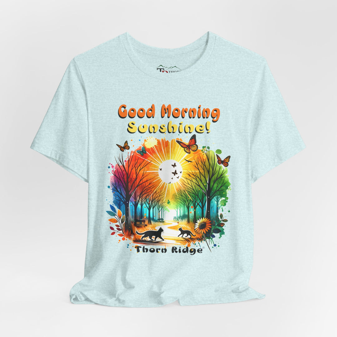 good morning sunshine graphic tee by Thorn Ridge featuring the sun shining through the trees and two cats walking across the path in a park.