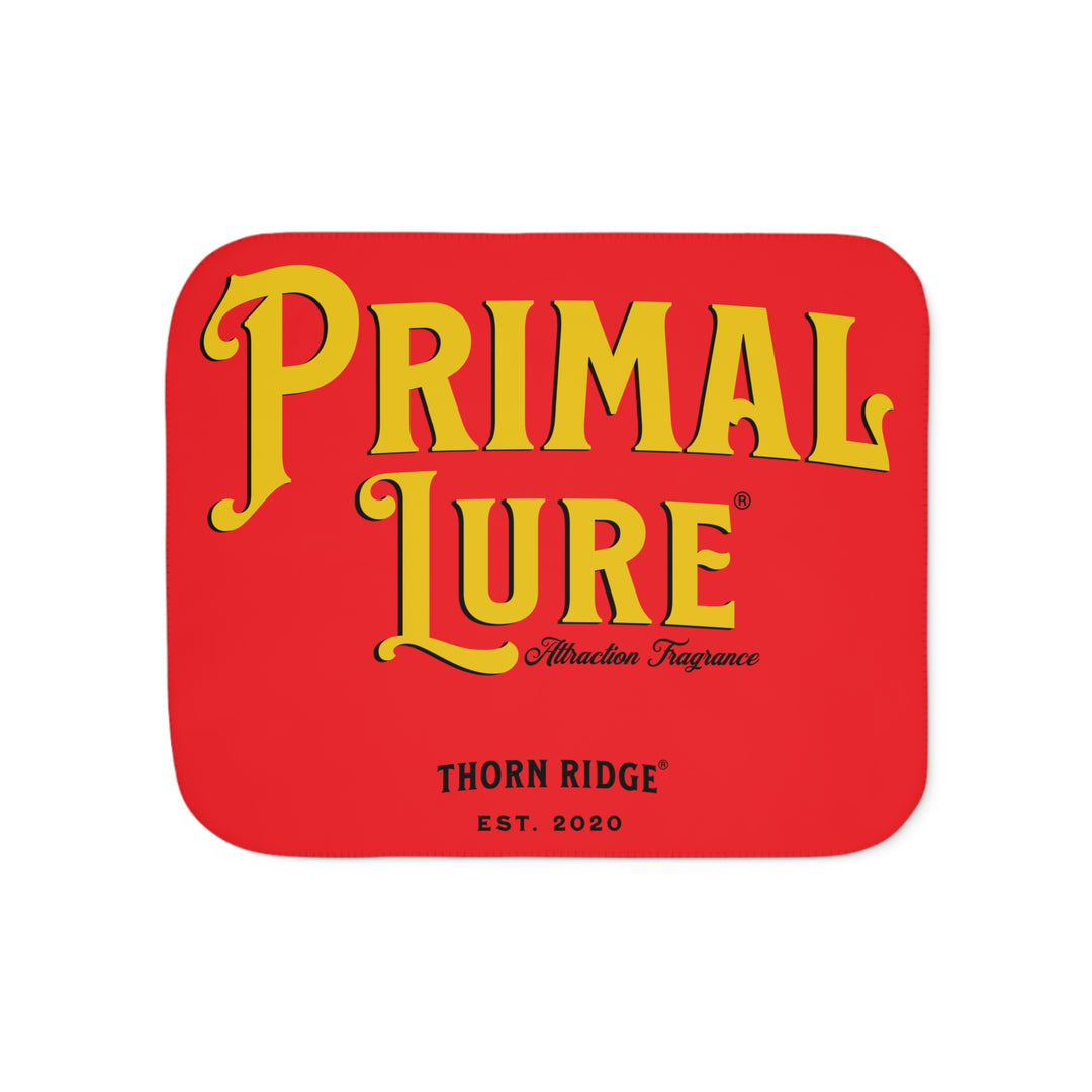Prinmal Lure Attraction Fragrance by Thorn Ridge® in gold on a red sherpa blanket