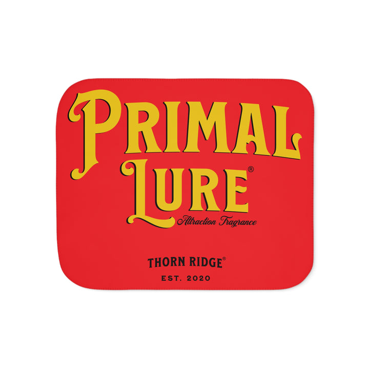 Prinmal Lure Attraction Fragrance by Thorn Ridge® in gold on a red sherpa blanket