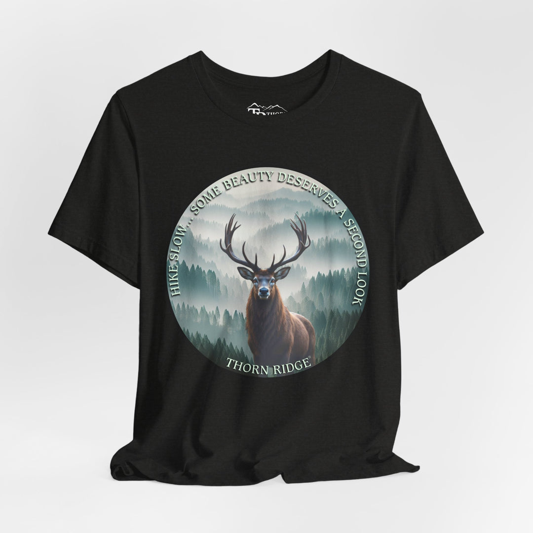 Hike Slow Some Beauty Deserves a Second Look tee with deer and mountains within a circular graphic by Thorn Ridge®