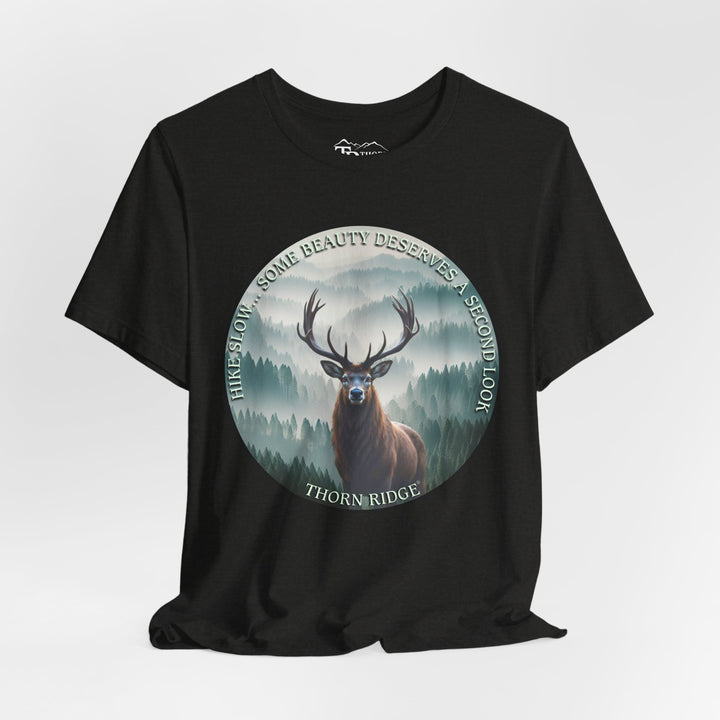 Hike Slow Some Beauty Deserves a Second Look tee with deer and mountains within a circular graphic by Thorn Ridge®