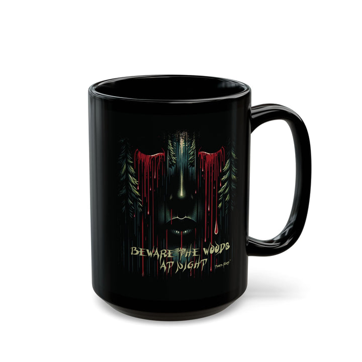 Black mug with a face emerging from the forest with bleeding eyes and a warning Beware the Woods at Night by Thorn Ridge®