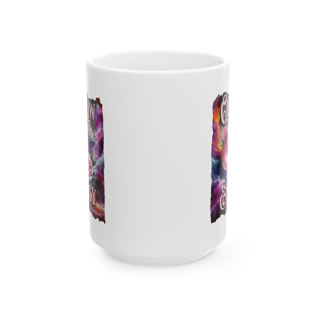 White mug with a colorful design featuring a pink cowboy hat and flowers, labeled 'Outlaw Energy' by Thorn Ridge®