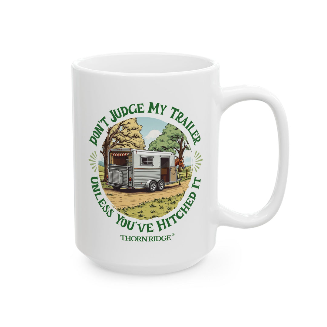 White mug with a graphic of a horse and horse trailer and text 'Don't Judge My Trailer Unless You've Hitched It' by Thorn Ridge®