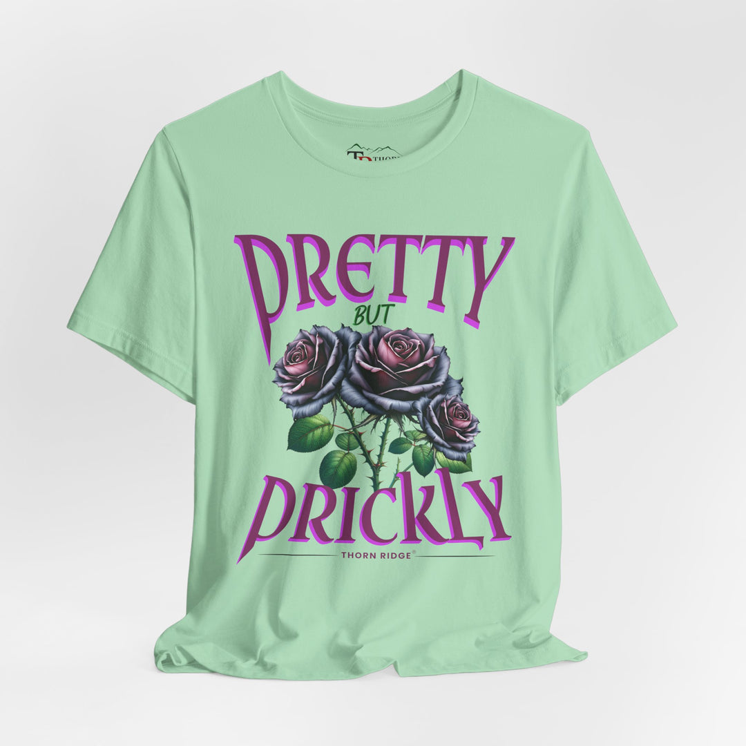 Pretty But Prickly Thorn Ridge Roses Branded t-shirt in purple with black and purple roses. 