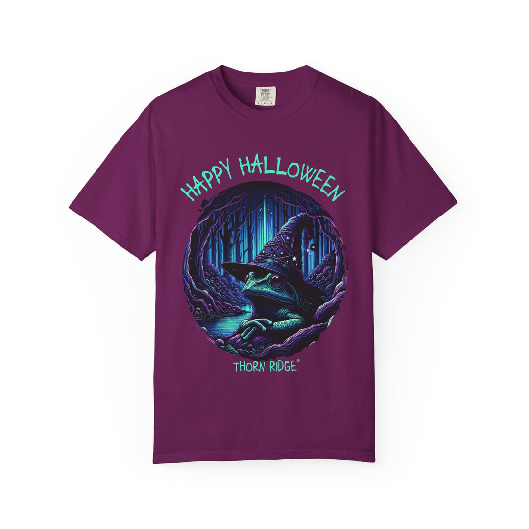 Happy Halloween from The Frog Witch labeled Thorn Ridge. Frog with a witches hat sitting by a dark stream in a wicked forest. 