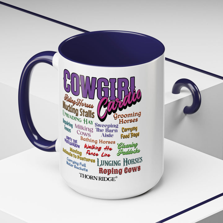 Mug with 'Cowgirl Cardio' text and blue handle on a white background