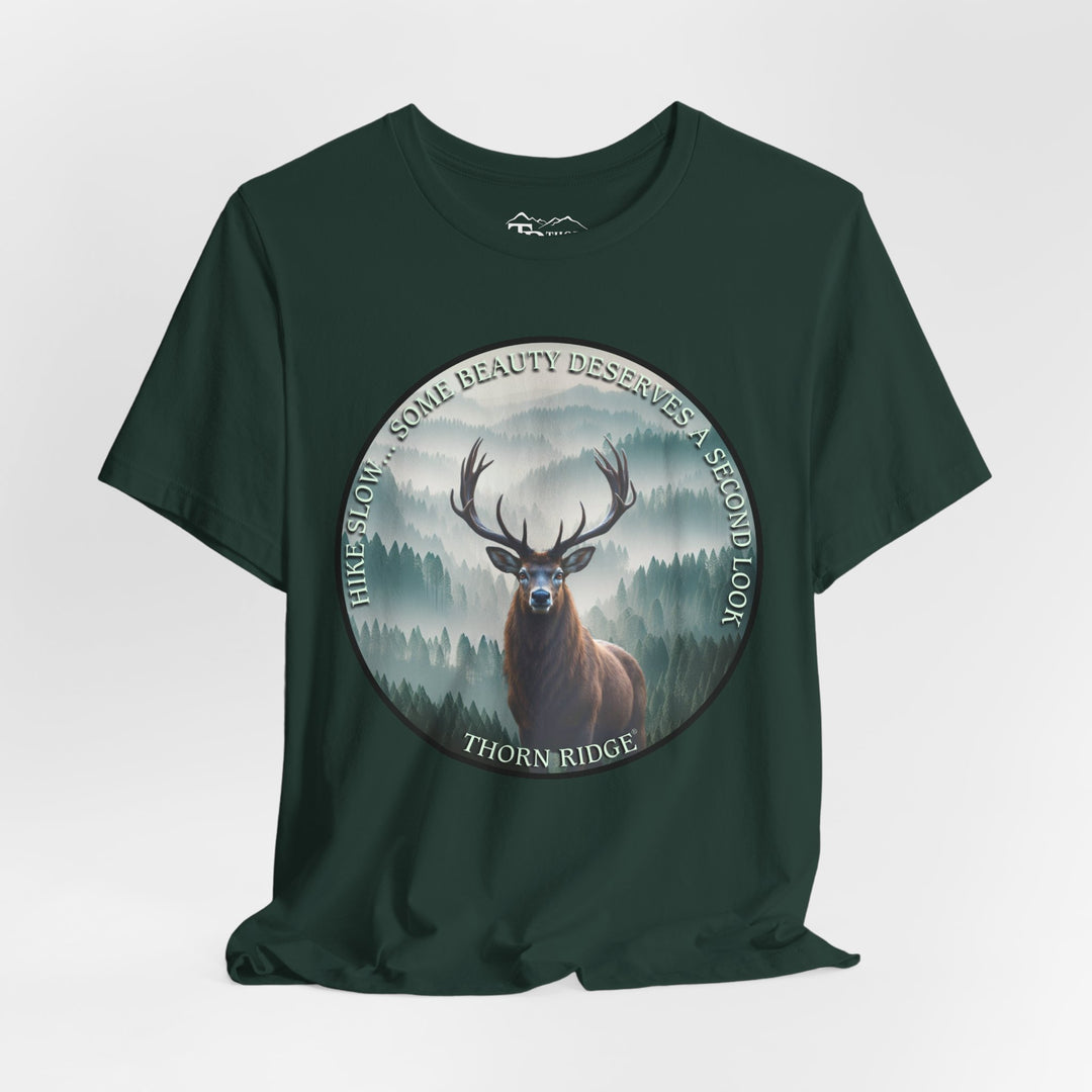 Hike Slow Some Beauty Deserves a Second Look tee with deer and mountains within a circular graphic by Thorn Ridge®