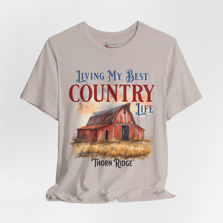 t-shirt with a graphic of a red barn and text 'Living My Best Country Life' branded Thorn Ridge®