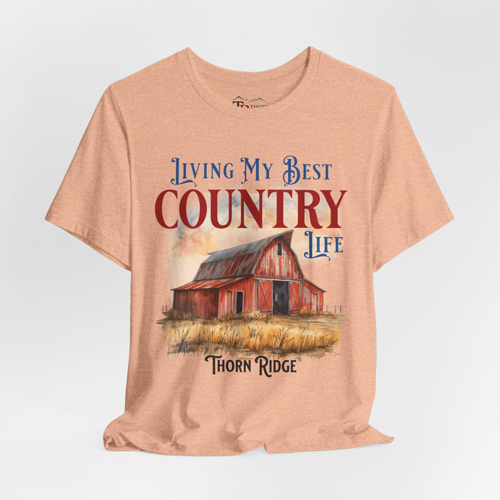 t-shirt with a graphic of a red barn and text 'Living My Best Country Life' branded Thorn Ridge®