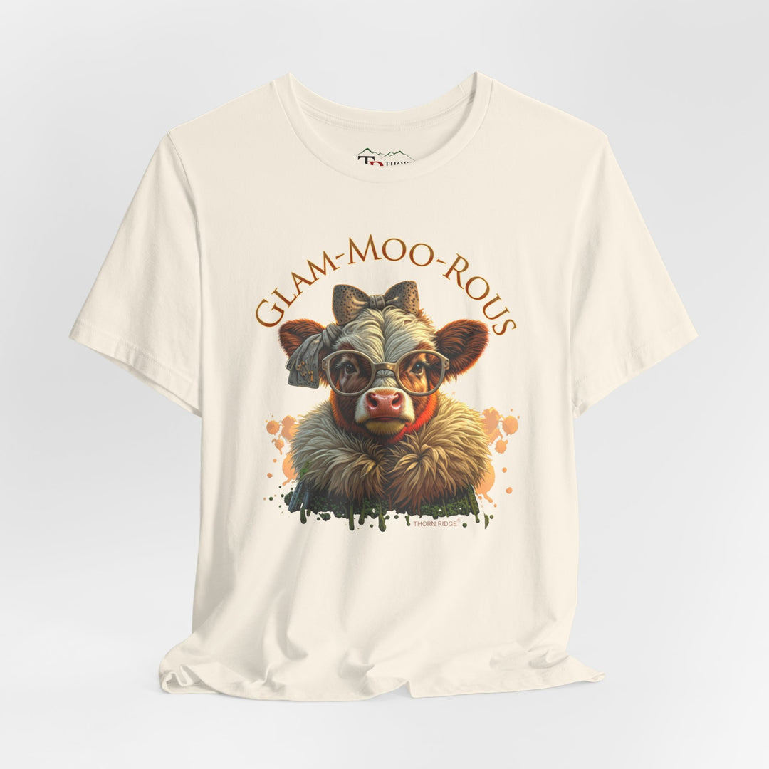 "Glam-Moo-Rous" Graphic Tee with a  Cow in brown tones with sunglasses and bows on her head and a boa around her neck. Labeled Thorn Ridge®
