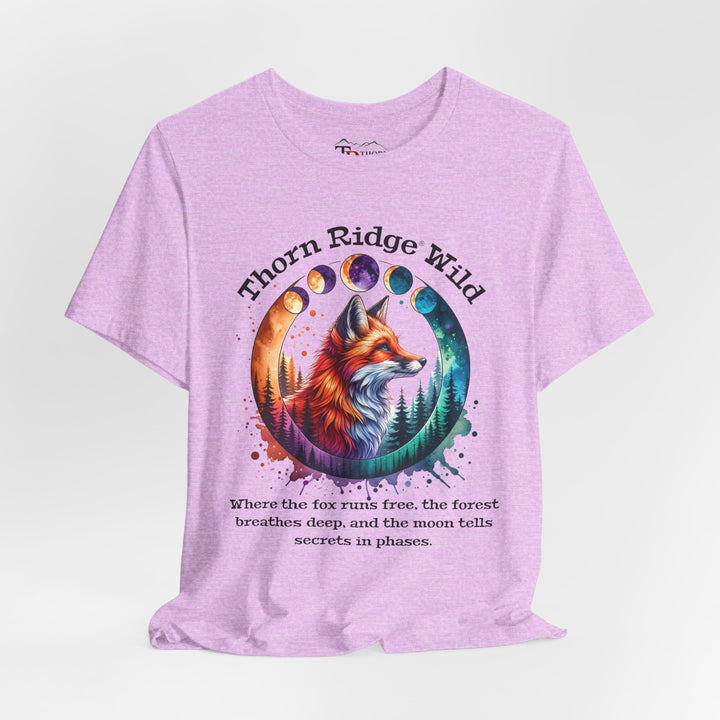 Thorn Ridge Wild Graphic Tee featuring a fox, forest, and moon phases. 