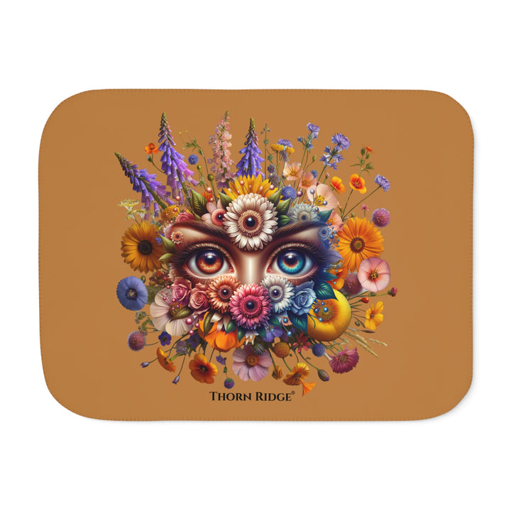 Colorful floral design with eyes on a brown background, featuring the brand 'Thorn Ridge'.