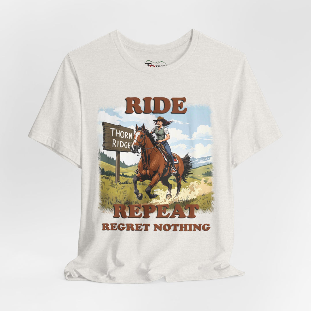 Ride Repeat Regret Nothing tee with a woman riding a galloping horse across the feild with the mountains in the background and a sign labeled Thorn Ridge®