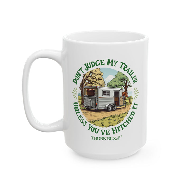 White mug with a graphic of a horse and horse trailer and text 'Don't Judge My Trailer Unless You've Hitched It' by Thorn Ridge®
