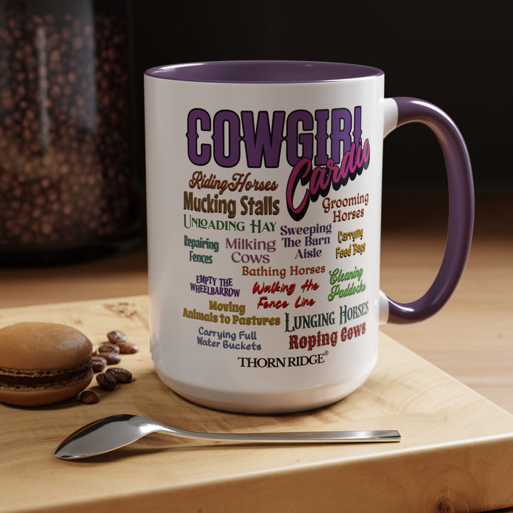 Mug with 'Cowgirl Cardio' text and purple handle on a white background