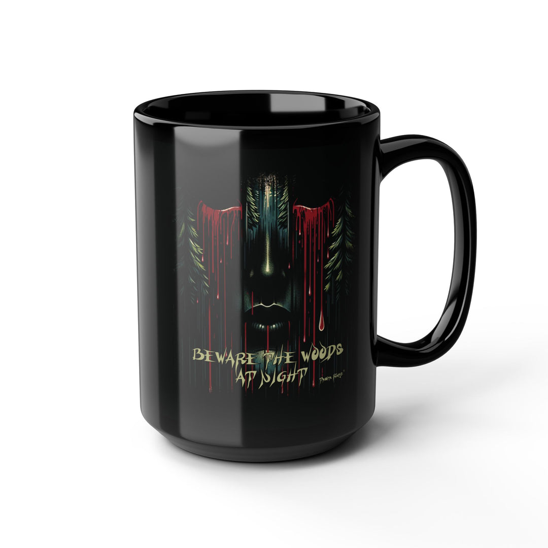 Black mug with a face emerging from the forest with bleeding eyes and a warning Beware the Woods at Night by Thorn Ridge®