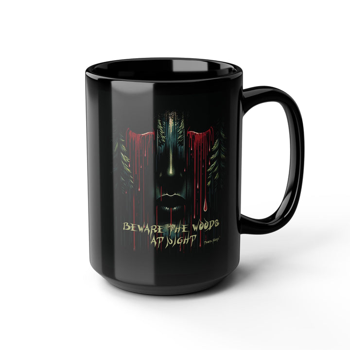Black mug with a face emerging from the forest with bleeding eyes and a warning Beware the Woods at Night by Thorn Ridge®