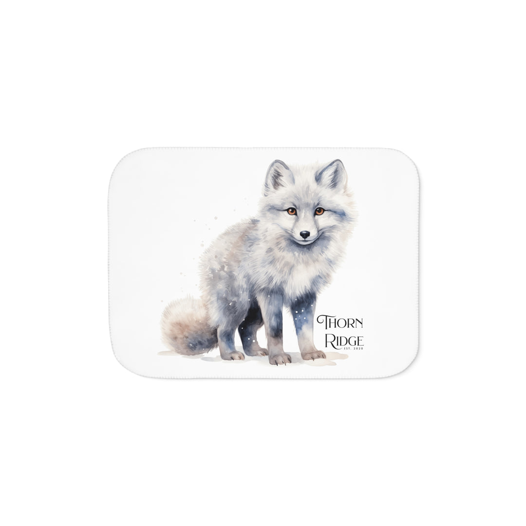 White Arctic fox illustration on a white Sherpa Blanket with 'Thorn Ridge' branding.