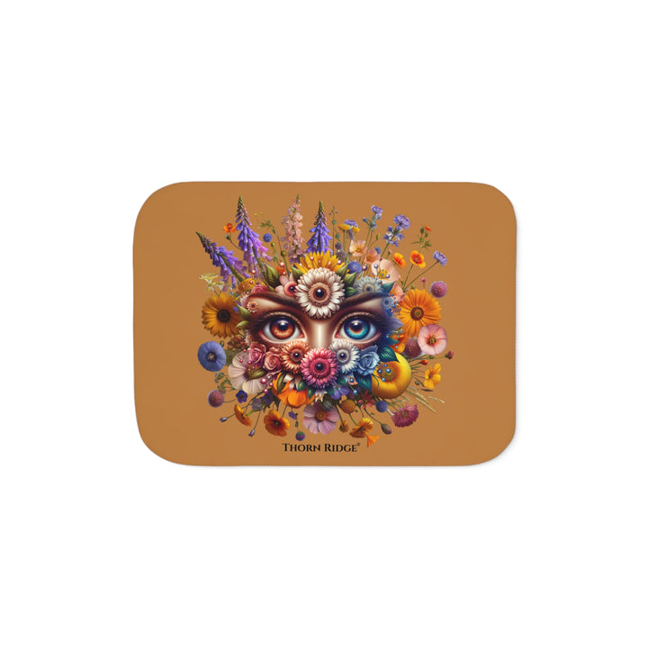 Colorful floral design with eyes on a brown background, featuring the brand 'Thorn Ridge'.