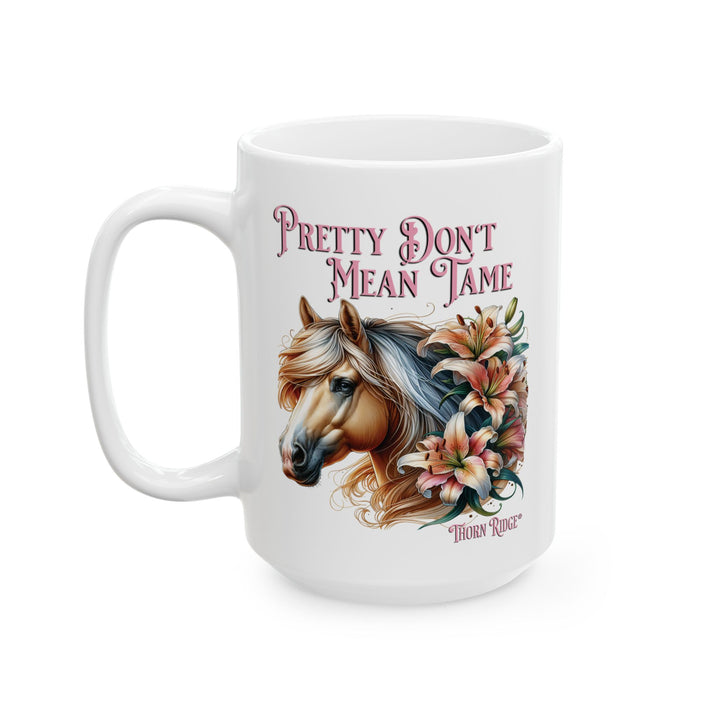 White mug with a horse and floral design, featuring the text 'Pretty Don't Mean Tame' by Thorn Ridge®
