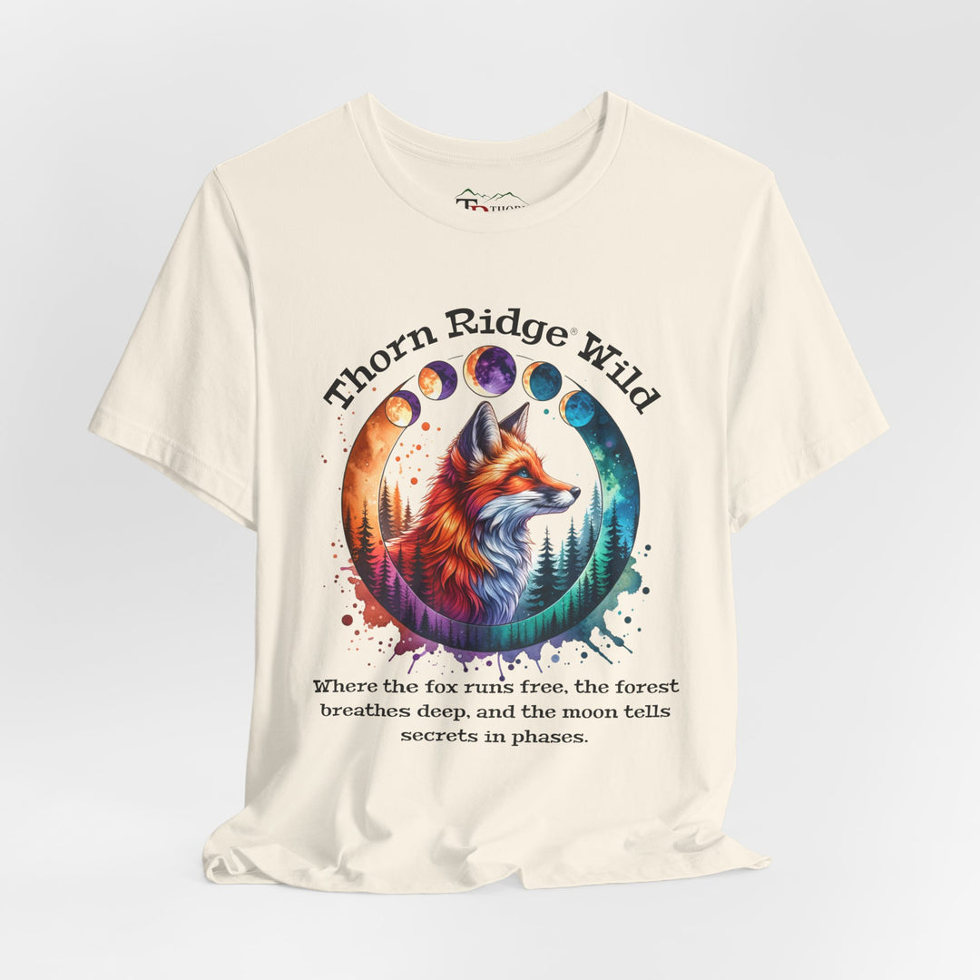 Thorn Ridge Wild Graphic Tee featuring a fox, forest, and moon phases. 