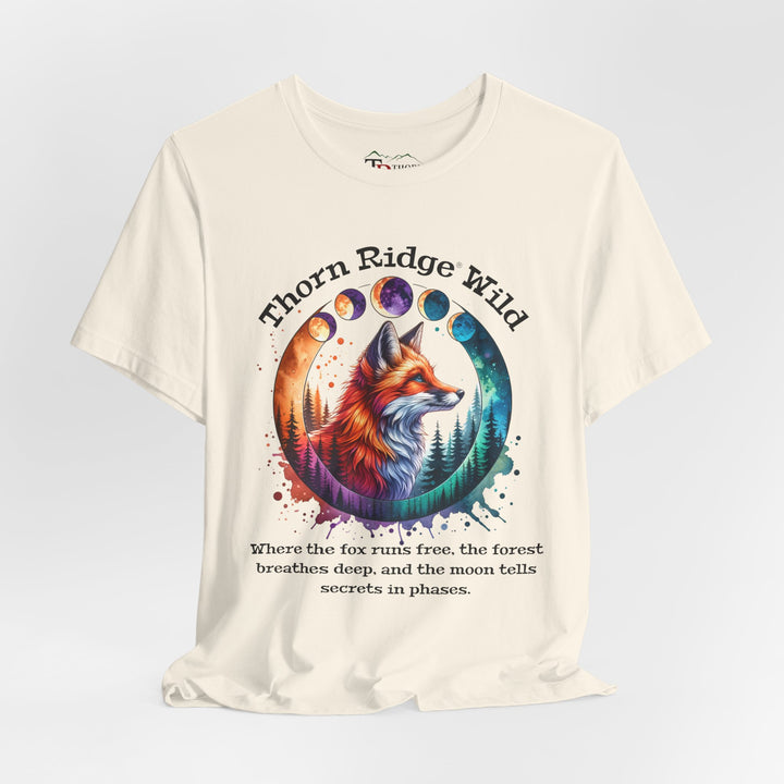 Thorn Ridge Wild Graphic Tee featuring a fox, forest, and moon phases. 