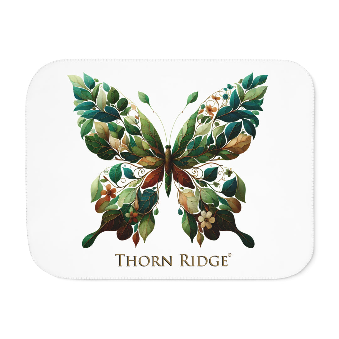 leaf Butterfly design on a white sherpa blanket with 'Thorn Ridge' branding
