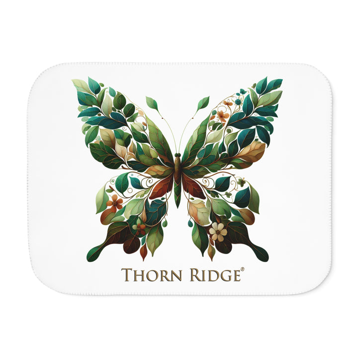 leaf Butterfly design on a white sherpa blanket with 'Thorn Ridge' branding