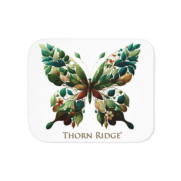 leaf Butterfly design on a white sherpa blanket with 'Thorn Ridge' branding