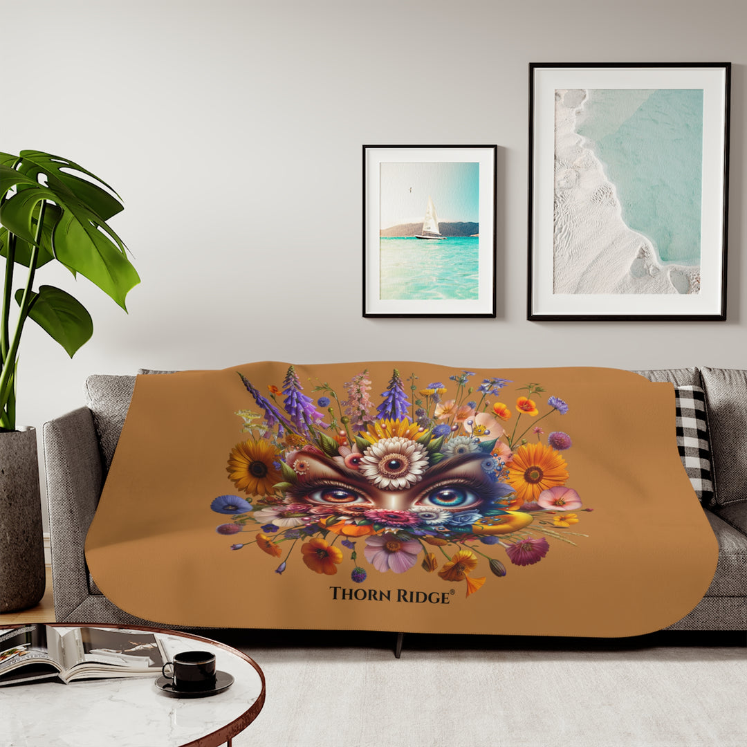 Colorful floral design with eyes on a brown background, featuring the brand 'Thorn Ridge'.