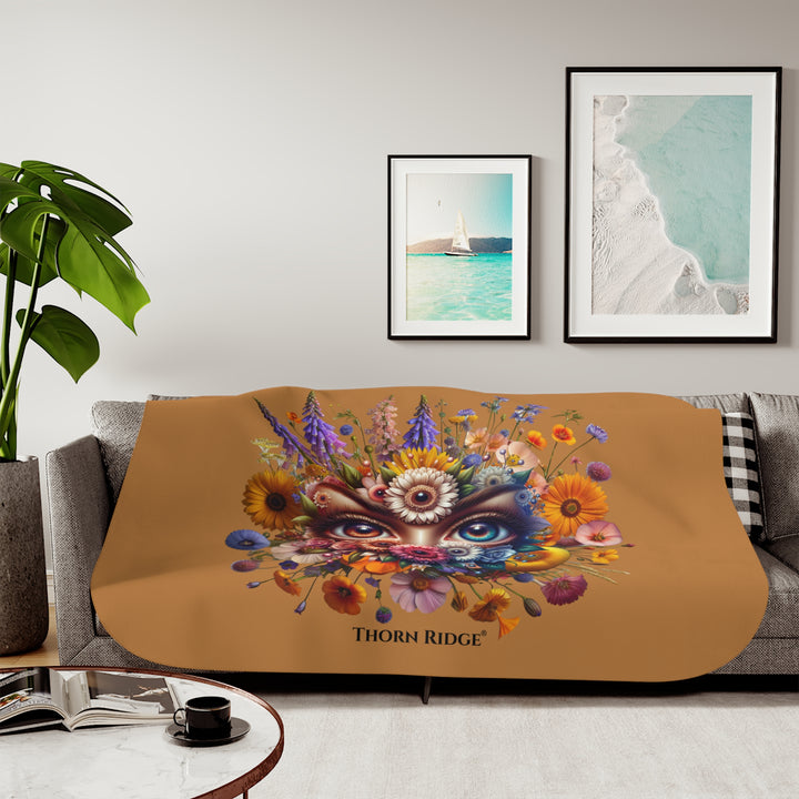 Colorful floral design with eyes on a brown background, featuring the brand 'Thorn Ridge'.