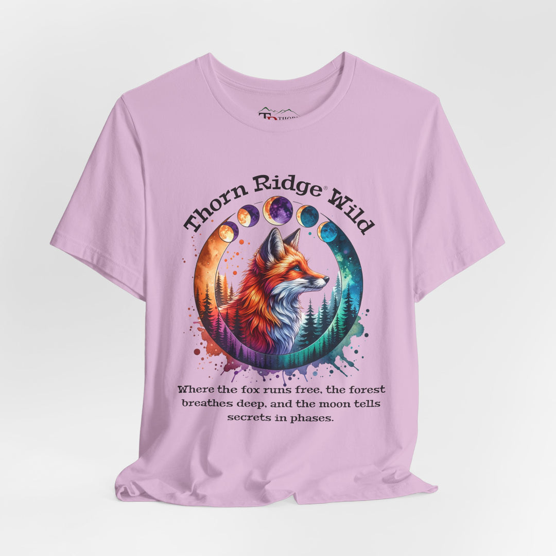 Thorn Ridge Wild Graphic Tee featuring a fox, forest, and moon phases. 