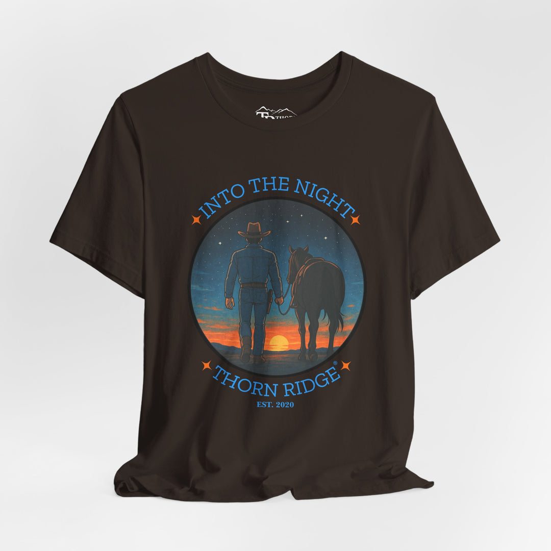 t-shirt with 'Into the Night' and 'Thorn Ridge' graphic design of a cowboy leading his horse into the setting sun as night is falling.