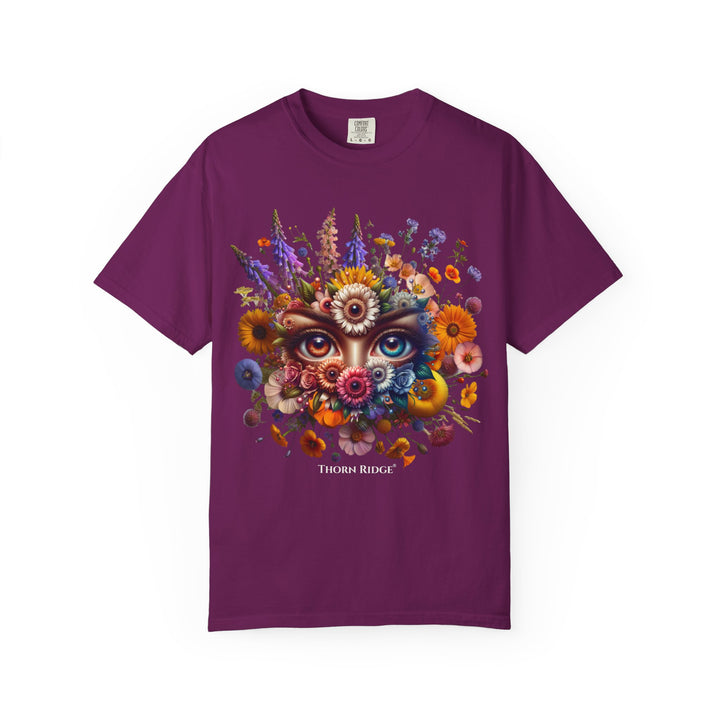 t-shirt with a colorful floral design and eyes in the center that seem like they're watching you. Branded Thorn Ridge®.