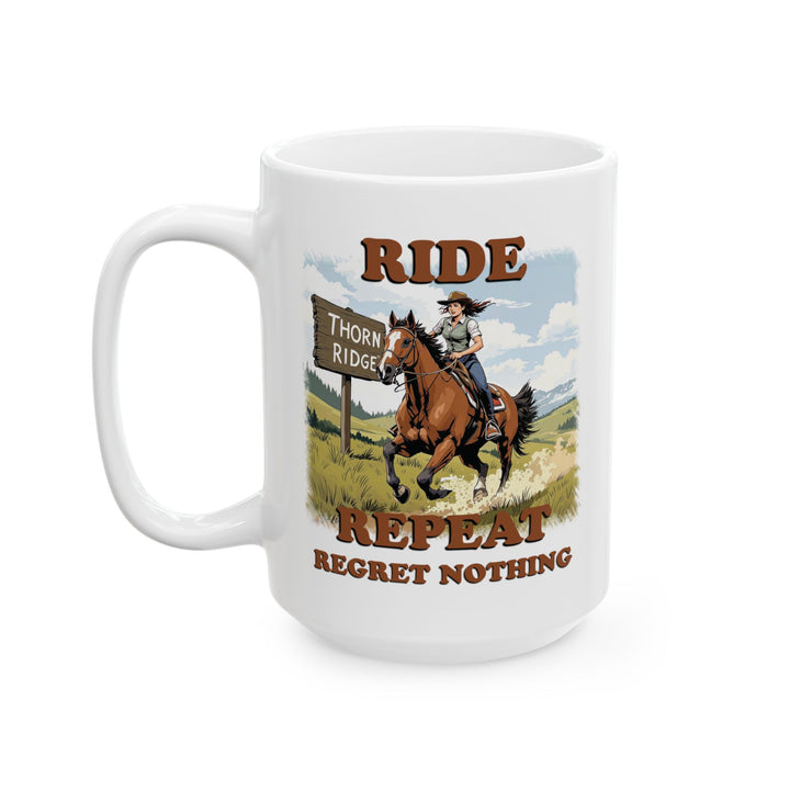 White mug with a graphic of a person riding a horse and text 'Ride  Repeat Regret Nothing' by Thorn Ridge®