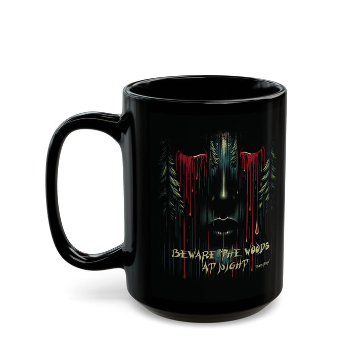 Black mug with a face emerging from the forest with bleeding eyes and a warning Beware the Woods at Night by Thorn Ridge®