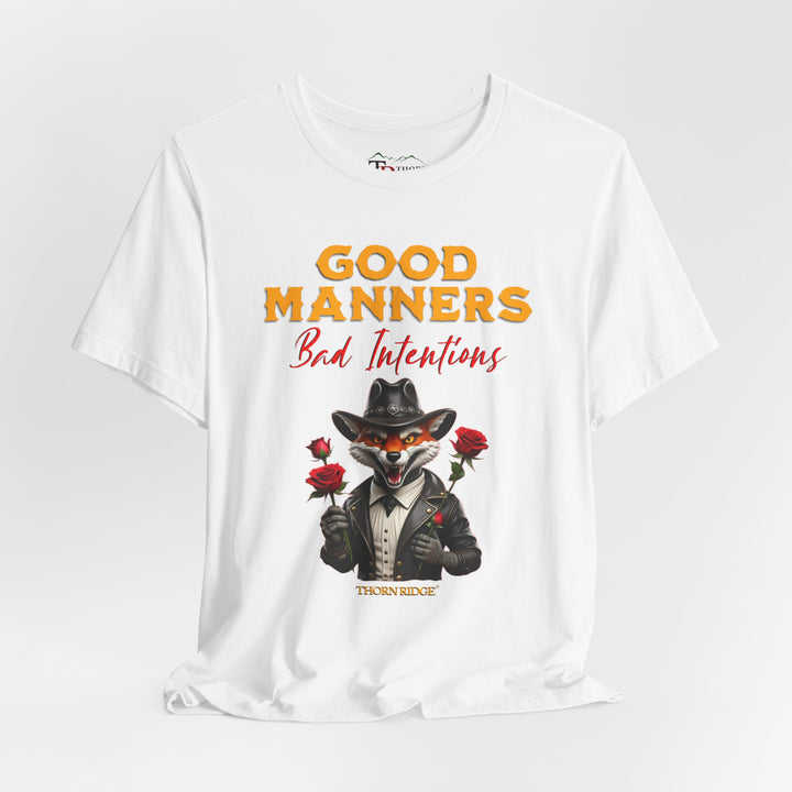 Good manners bad intentions graphic tee with a grinning fox wearing a black cowboy hat and leather jacket with human hands holding roses.  labeled Thorn Ridge®