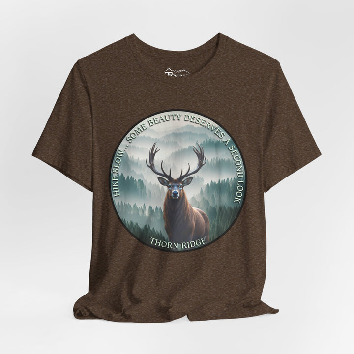 Hike Slow Some Beauty Deserves a Second Look tee with deer and mountains within a circular graphic by Thorn Ridge®