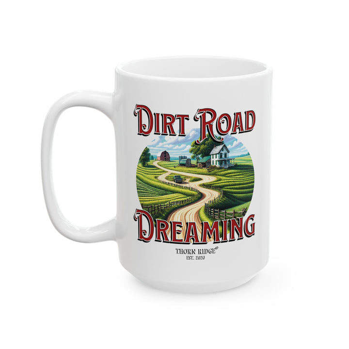White mug with 'Dirt Road Dreaming' design featuring a rural scene of a farmhouse and feilds by Thorn Ridge®