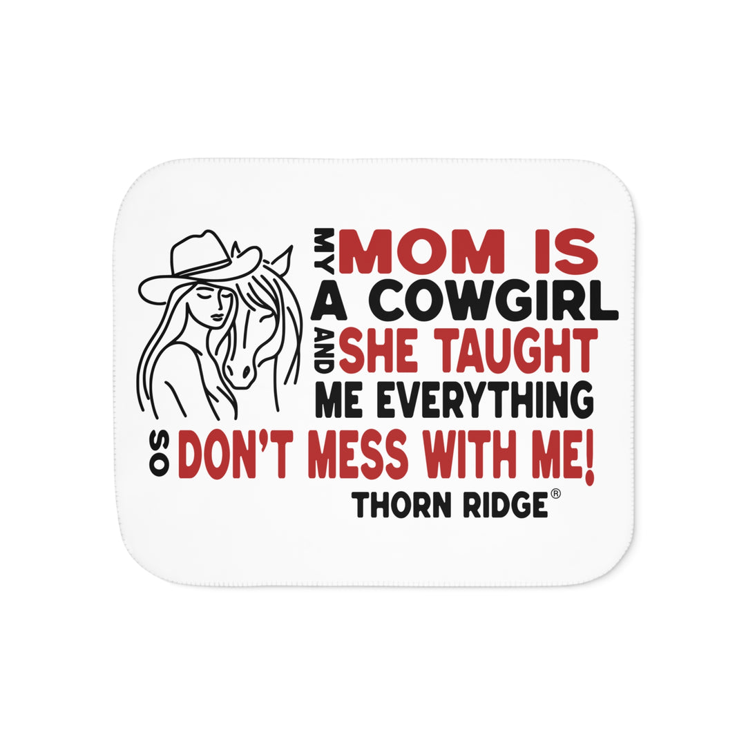 Mom Is A Cowgirl and she taught me everything so don't mess with me slogan graphic with a outline drawing of a woman with a cowboy hat hugging a horse by Thorn Ridge®