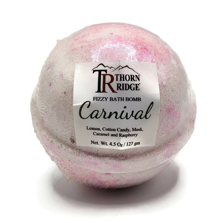 A Thorn Ridge fizzy bath bomb labeled "Carnival," described as a lemon, cotton candy, musk, caramel and raspberry  fragrance. 4.5 oz.