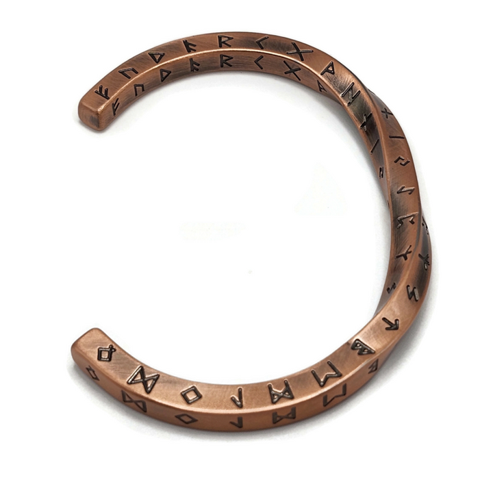 Copper rune twist bracelet with engraved rune symbols. Stainless steel.
