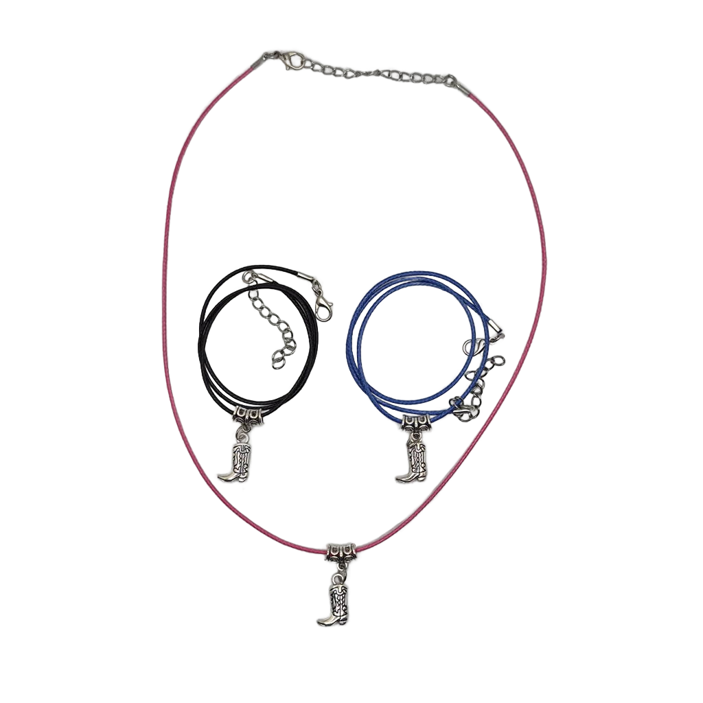 Zinc alloy cowboy boot on either a pink, blue, or black vegan leather necklace with a 2" extender chain. 