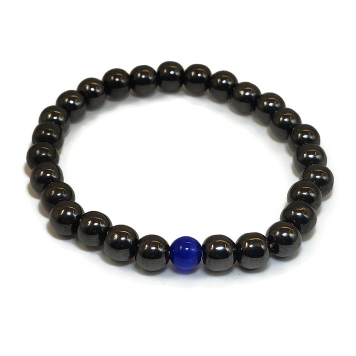 Magnetic bracelet with a dark blue gemstone.